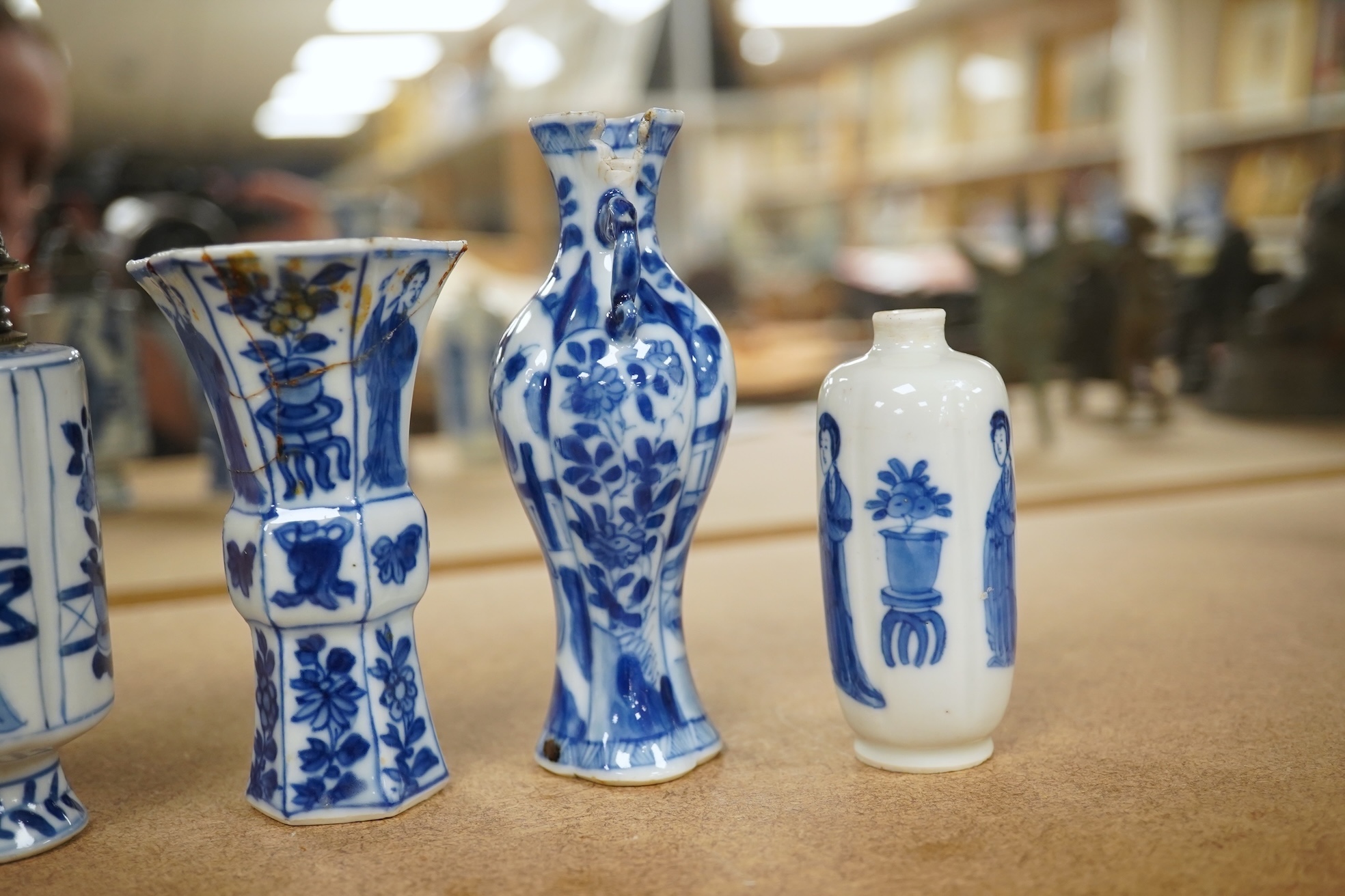 Five Chinese blue and white small vases, Kangxi period, one Dutch silver mounted as a sugar castor, tallest 11cm. Condition - varies